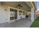 Covered patio includes a ceiling fan and sliding glass door to the home at 3247 N Loma Vis, Mesa, AZ 85213