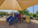 Shaded community playground featuring colorful play structures and soft, sandy ground with desert landscaping at 3247 N Loma Vis, Mesa, AZ 85213