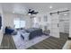 Inviting primary bedroom with stylish decor, a ceiling fan, and ample natural light at 3401 N 37 St # 14, Phoenix, AZ 85018
