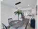Inviting dining space with modern lighting and an open view to the kitchen at 3401 N 37 St # 14, Phoenix, AZ 85018