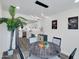 Charming dining area with a modern light fixture, round table, and adjacent kitchen at 3401 N 37 St # 14, Phoenix, AZ 85018