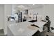 This bright kitchen has stainless steel appliances, an island, and quartz countertops at 3401 N 37 St # 14, Phoenix, AZ 85018