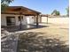 A spacious backyard features a covered patio, offering ample space for outdoor entertaining and relaxation at 3514 W Altadena Ave, Phoenix, AZ 85029