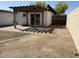 A backyard featuring a covered patio, a block wall, and plenty of space for outdoor activities at 3514 W Altadena Ave, Phoenix, AZ 85029
