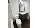 Modern bathroom featuring a sleek vanity, tile shower and tub combination with a dark wood floor at 3514 W Altadena Ave, Phoenix, AZ 85029