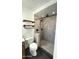 Contemporary bathroom features a custom tile shower with river rock flooring at 3514 W Altadena Ave, Phoenix, AZ 85029