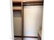 Walk-in closet featuring wood shelving, drawers, a marble countertop, and white walls at 3514 W Altadena Ave, Phoenix, AZ 85029