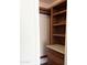 Walk-in closet with wood shelving, drawers, and a marble countertop at 3514 W Altadena Ave, Phoenix, AZ 85029