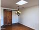 Elegant dining area showcases a rustic sliding barn door and stylish chandelier at 3514 W Altadena Ave, Phoenix, AZ 85029