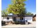 Charming single-story home featuring desert landscaping, a black roof, and a cozy covered entryway at 3514 W Altadena Ave, Phoenix, AZ 85029