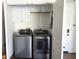 Well-appointed laundry room with white cabinets, and new washer and dryer at 3514 W Altadena Ave, Phoenix, AZ 85029