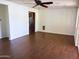 Spacious living room with wood-look tile flooring and ceiling fan at 3514 W Altadena Ave, Phoenix, AZ 85029