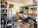 The shed interior features storage shelves, an air conditioner, and ample space for tools and equipment at 3514 W Altadena Ave, Phoenix, AZ 85029