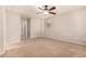 Spacious bedroom with neutral walls, carpet floors and a ceiling fan, creating a relaxing atmosphere at 3552 E Carla Vista Dr, Gilbert, AZ 85295