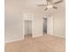 Bright bedroom featuring neutral walls, carpet floors, ceiling fan and access to walk-in closet at 3552 E Carla Vista Dr, Gilbert, AZ 85295