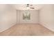 Spacious bedroom with a ceiling fan and one large window at 3552 E Carla Vista Dr, Gilbert, AZ 85295