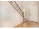 Bright entryway with tile flooring, staircase with iron railings, and a white front door at 3552 E Carla Vista Dr, Gilbert, AZ 85295