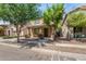 Delightful home with covered porch and desert landscaping creating an inviting curb appeal at 3552 E Carla Vista Dr, Gilbert, AZ 85295