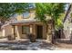 Beautiful two-story home with covered porch, lush front yard and stone accents at 3552 E Carla Vista Dr, Gilbert, AZ 85295