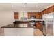 Kitchen with granite counters, stainless steel appliances, and ample cabinet space at 3552 E Carla Vista Dr, Gilbert, AZ 85295