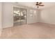 Spacious living room with sliding glass door to the outside covered patio at 3552 E Carla Vista Dr, Gilbert, AZ 85295