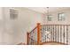 Staircase with decorative metal and wood banister and lots of light at 3552 E Carla Vista Dr, Gilbert, AZ 85295