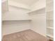 Bright walk-in closet with shelving, carpet and rod, offering plenty of storage at 3552 E Carla Vista Dr, Gilbert, AZ 85295
