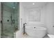 Elegant bathroom showcases a modern soaking tub and a glass-enclosed walk-in shower at 37200 N Cave Creek Rd # 1122, Scottsdale, AZ 85262