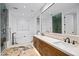 Bright bathroom featuring a soaking tub, walk-in shower, and double vanity with marble countertops at 37200 N Cave Creek Rd # 1122, Scottsdale, AZ 85262