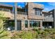 Multi-story home featuring stone accents, modern design elements, and a well-maintained landscape at 37200 N Cave Creek Rd # 1122, Scottsdale, AZ 85262