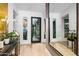 Bright and inviting foyer with hardwood floors, modern accents and views to the exterior at 37200 N Cave Creek Rd # 1122, Scottsdale, AZ 85262