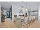 Modern kitchen with island, pendant lighting, stainless steel appliances and a view to entry hall at 37200 N Cave Creek Rd # 1122, Scottsdale, AZ 85262