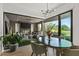Open dining area with golf course views leading into a spacious living room with a fireplace at 37200 N Cave Creek Rd # 1122, Scottsdale, AZ 85262