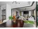 Cozy dining area featuring views into a luxurious living room and stainless steel appliances at 37200 N Cave Creek Rd # 1122, Scottsdale, AZ 85262