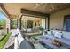 Comfortable outdoor patio with seating and views of an open concept dining and kitchen area at 37200 N Cave Creek Rd # 1122, Scottsdale, AZ 85262