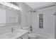 Bright bathroom with marble tiled shower with rainfall shower head and decorative inset at 4031 N Ranier --, Mesa, AZ 85215