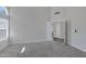 A spacious bedroom offering natural light through window and a door leading to living area at 4031 N Ranier --, Mesa, AZ 85215