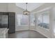Dining area with large windows, and a modern light fixture at 4031 N Ranier --, Mesa, AZ 85215