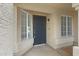Inviting entryway with neutral accents and a dark front door with side windows at 4031 N Ranier --, Mesa, AZ 85215