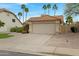 Single-story home with a tile roof, desert landscaping, and a two-car garage at 4031 N Ranier --, Mesa, AZ 85215