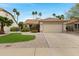 Inviting single-story home with a tile roof, desert landscaping, and a two-car garage at 4031 N Ranier --, Mesa, AZ 85215