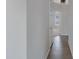 Hallway with tile flooring leading to a brightly lit room at 4031 N Ranier --, Mesa, AZ 85215