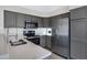 Kitchen features stainless steel appliances, gray cabinets and quartz countertops at 4031 N Ranier --, Mesa, AZ 85215