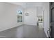 Bright, open living room with a large window and tile floors and an updated light fixture at 4031 N Ranier --, Mesa, AZ 85215