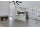 Open-concept living space with a fireplace, tile flooring, and gray accents at 4031 N Ranier --, Mesa, AZ 85215