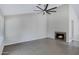Living room with fireplace, ceiling fan, and tile flooring at 4031 N Ranier --, Mesa, AZ 85215