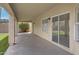 Covered patio with textured ceiling, sliding glass door, and a view of the backyard at 4031 N Ranier --, Mesa, AZ 85215