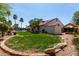 Backyard view showcasing the lush lawn, mature landscaping, and an inviting pool area at 4525 E Desert View Dr, Phoenix, AZ 85044