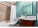 Bathroom with beautiful vanity, brushed nickel fixtures, and tub and shower with tile surround at 4525 E Desert View Dr, Phoenix, AZ 85044