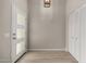 Bright entryway with light wood floors, closet, and natural light creates a warm and welcoming ambiance at 4525 E Desert View Dr, Phoenix, AZ 85044